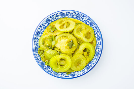 A plate of stir-fried green tomatoes