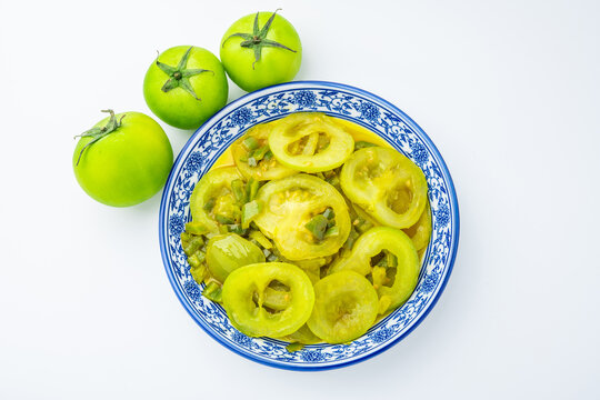 A plate of stir-fried green tomatoes