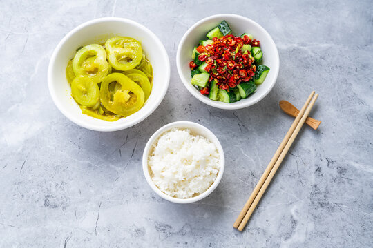 Chinese-style vegetarian weight-loss meal: Smashed cucumber salad and stir-fried green tomatoes with rice.