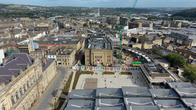 Drone view of newly opened Queensgate Square and Huddersfield Library Hub, featuring the ongoing work complete the rest of the Kirklees 'Our Cultural Heart' project