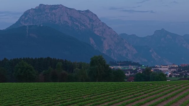 Aerial view of Traunstein mountain peak over green fields in Salzkammergut
