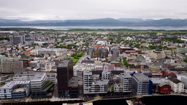 Modern waterfront architecture and city center in Bodo, Norway. Aerial backward