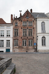 Obraz premium Bruges historic brick building with white front neighbors