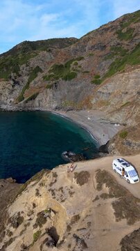 La Frana Beach in Sardinia offers stunning views of the crystal-clear water and rugged coastline. This serene spot invites relaxation and exploration in Italys picturesque landscape in a camper van