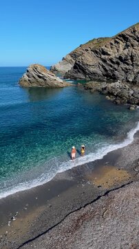 Discover the stunning La Frana Beach in Sardinia, Italy, where turquoise waters meet rocky cliffs. Enjoy a serene atmosphere perfect for relaxation and exploration under the clear blue sky.