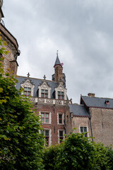 Obraz premium Bruges historic brick building with tower and cloudy sky