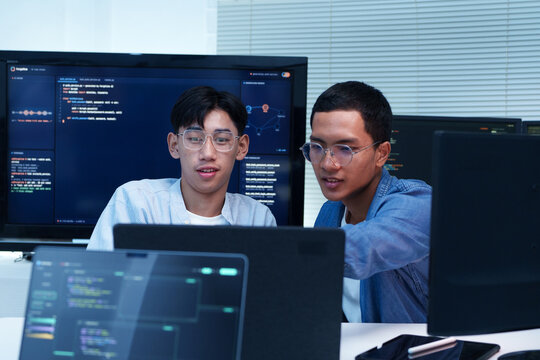 Programmers Collaborating on AI Software Development