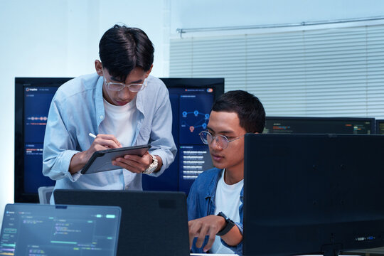 Programmers Collaborating on Software Development and AI Technology