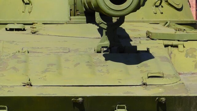 muzzle of a self-propelled gun painted in army green, panorama