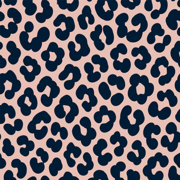 Seamless leopard print vector background featuring dark navy blue animal spots on a pastel blush pink backdrop. Perfect modern texture style for fashion fabrics, textile designs, banner, and wallpaper