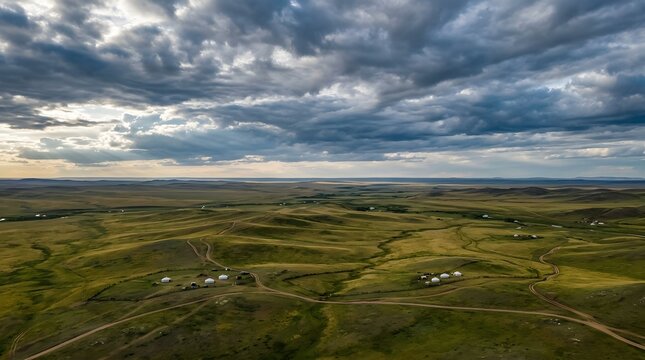 Mongolia steppe aerial, endless grassland, dramatic sky, no text no people