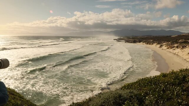 massive wave sets rolling into shore, Walker Bay Nature Reserve, South Africa at sunset