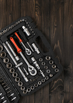 Close-up of high-quality screw-on metal cutting burs and abrasive rotary tool bits. Industrial carving, deburring, and grinding attachments on a white reflective studio surface.