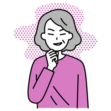 悪巧みをする年配の女性