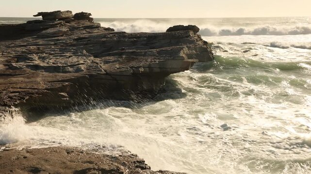 overhead view of massive wave sets rolling into Walker Bay Nature Reserve beach, South Africa