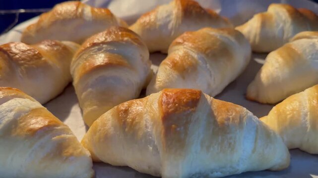 Fresh golden croisant in oven