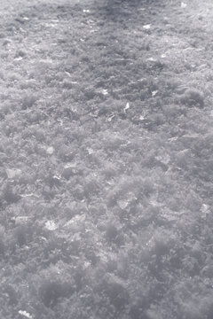 High angle texture of frozen snow and hoarfrost on the ground