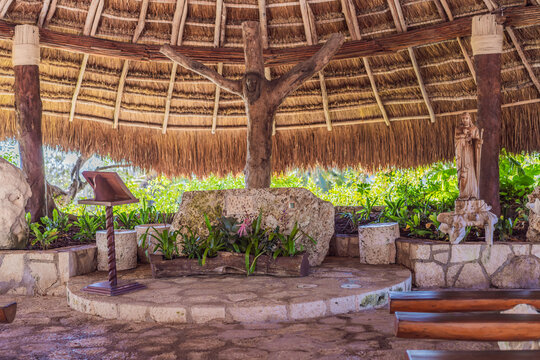 Thatched roof relaxation area with hammocks and natural materials shows resort leisure, tropical travel and outdoor wellness concept