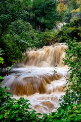 High water cascades over travertine terraces at Krushuna Waterfalls in Bulgaria © Nikolay Dimitrov