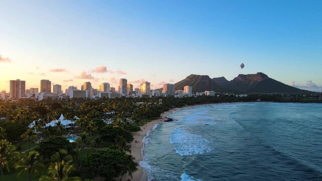 Photorealistic cinematic view of Honolulu skyline across Ala Moana Beach Park toward Diamond Head at sunrise, capturing Pacific water, tropical vegetation, volcanic terrain and reflections