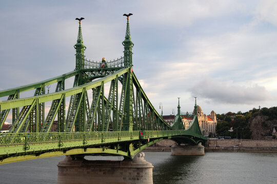 Low angle view of the green iron Liberty Bridge crossing the Danube River in Budapest