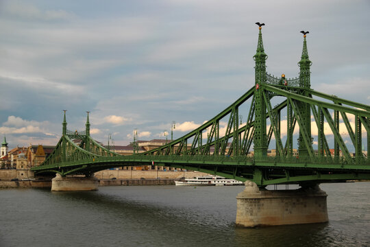 Liberty Bridge green iron structure crossing the Danube River in Budapest Hungary