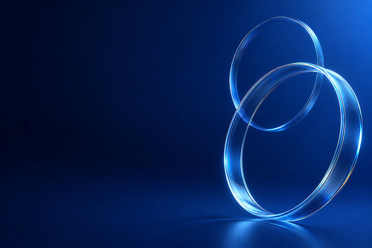 Abstract 3d background with glowing glass rings and copy space on deep blue. Futuristic luxury ring banner.