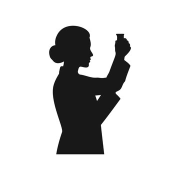 Scientist woman examining a test tube or flask in a laboratory setting silhouette