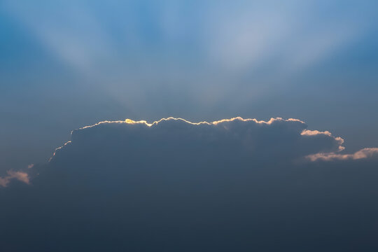 bright sunlit cloud edge blue sky