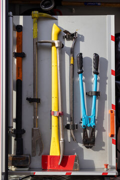 September 13, 2026, Bialystok, Poland. Heavy duty firefighter rescue tools including axes, crowbars and bolt cutters mounted on a truck panel. Concept of forcible entry, emergency tools and safety.