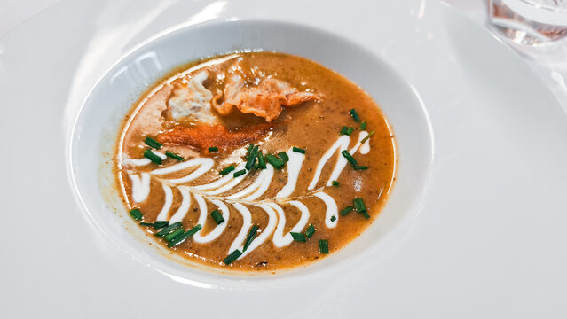 Gourmet seafood bisque with fresh chives and cream