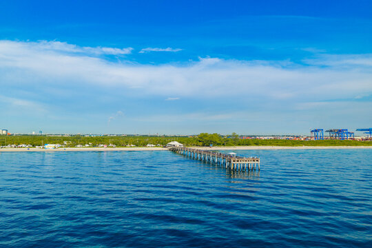 Aerial stock photo Dania Beach fishing pier with port in background