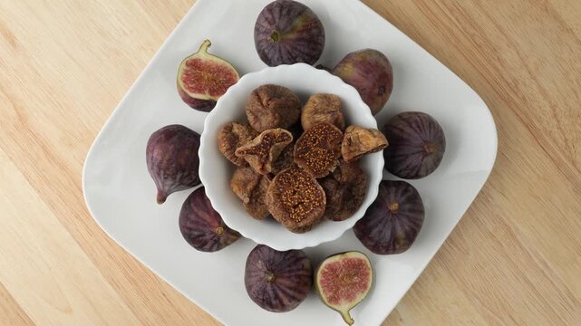 Fresh and dried figs on a rotating plate