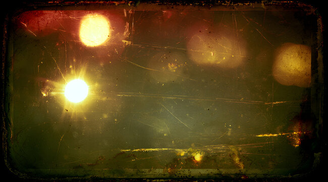 A vintage film texture, distressed with bright light leaks and sepia bokeh effects, emulating an aged and historical aesthetic, perfect for photographic designs featuring cracks and chemical stains.