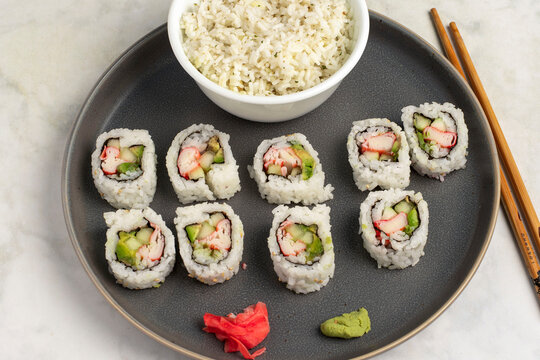 california rolls served with a side pf rice