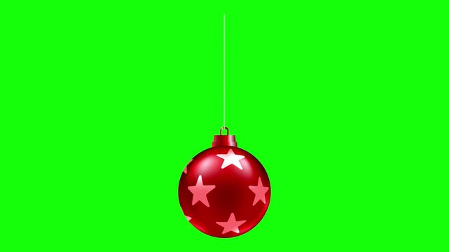 Red Christmas bauble with stars decoration gently swinging on a green screen, for holiday video compositing, promotions and festive motion graphics.