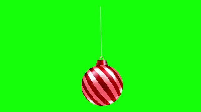 Red Christmas bauble with stripes decoration gently swinging on a green screen, for holiday video compositing, promotions and festive motion graphics.