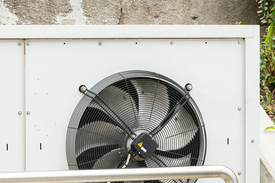 San Vito di Cadore, Italy. Close-up of outdoor heat pump condenser with large ventilation fan