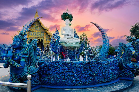 Blue temple wat rong suea ten chiang rai thailand ornate blue fountain with white buddha at sunset for travel poster and background wallpaper