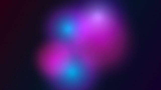 Abstract blurred background with glowing pink and blue light spots