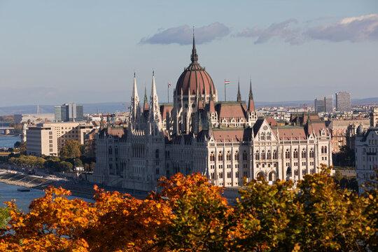 Hungarian Parliament Building Framed by Autumn Foliage in Budapest