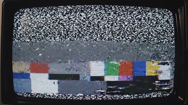 Vintage television static test pattern progression with analog signal disruption during broadcast interruption