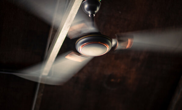 Wooden cooler fan on the roof of a wooden hut