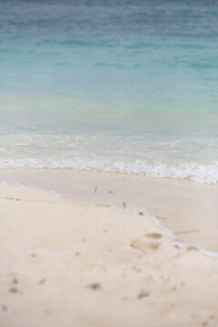 White sand beach with transparent water shore in Maldives