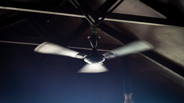 Wooden cooler fan on the roof of a wooden hut