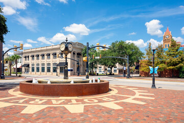 The historic Main Street corner clock tower with the Opera House Clock Tower behind, in the...
