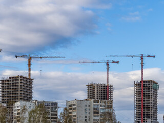 Tower crane at a construction site against the sky © Dmitrii Potashkin