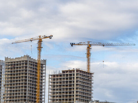 Tower crane at a construction site against the sky