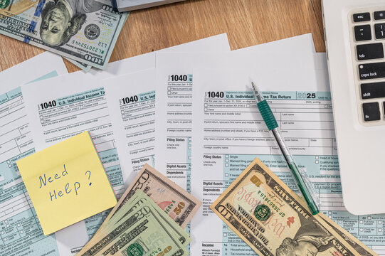 Yellow Sticky Note with Need Help Text on US Tax Form 1040 and Cash Dollars for Advisory Concept