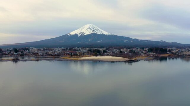 Telephoto View of Mount Fuji Across Lake Kawaguchiko Shoreline and Water